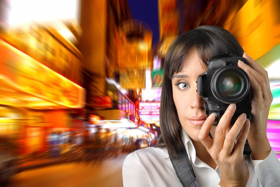 bigstock-Woman-taking-picture-of-modern-900-600-12155660